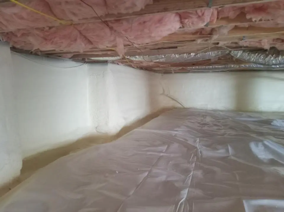 Crawl space encapsulation with closed-cell spray foam for Commercial Roof Restoration in Linda